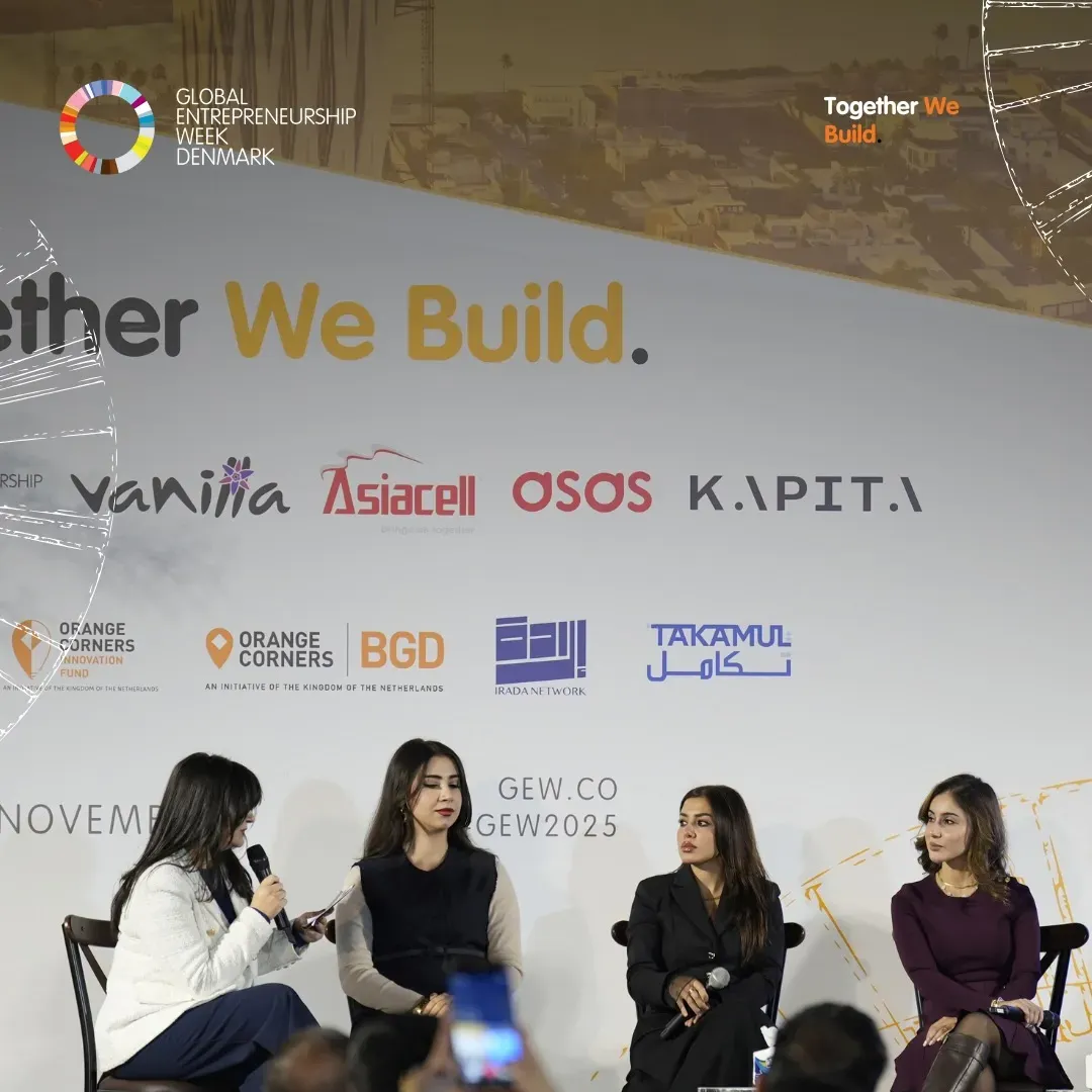 Women speakers seated on stage during a panel at the Beauty and Entrepreneurship Forum, KAPITA