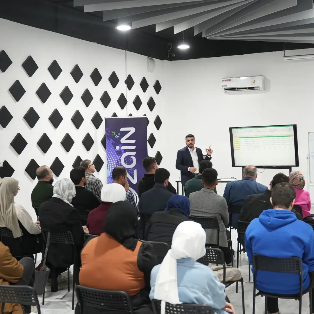 Audience at Mosul Space listening to a speaker during the session on investment and attracting investors