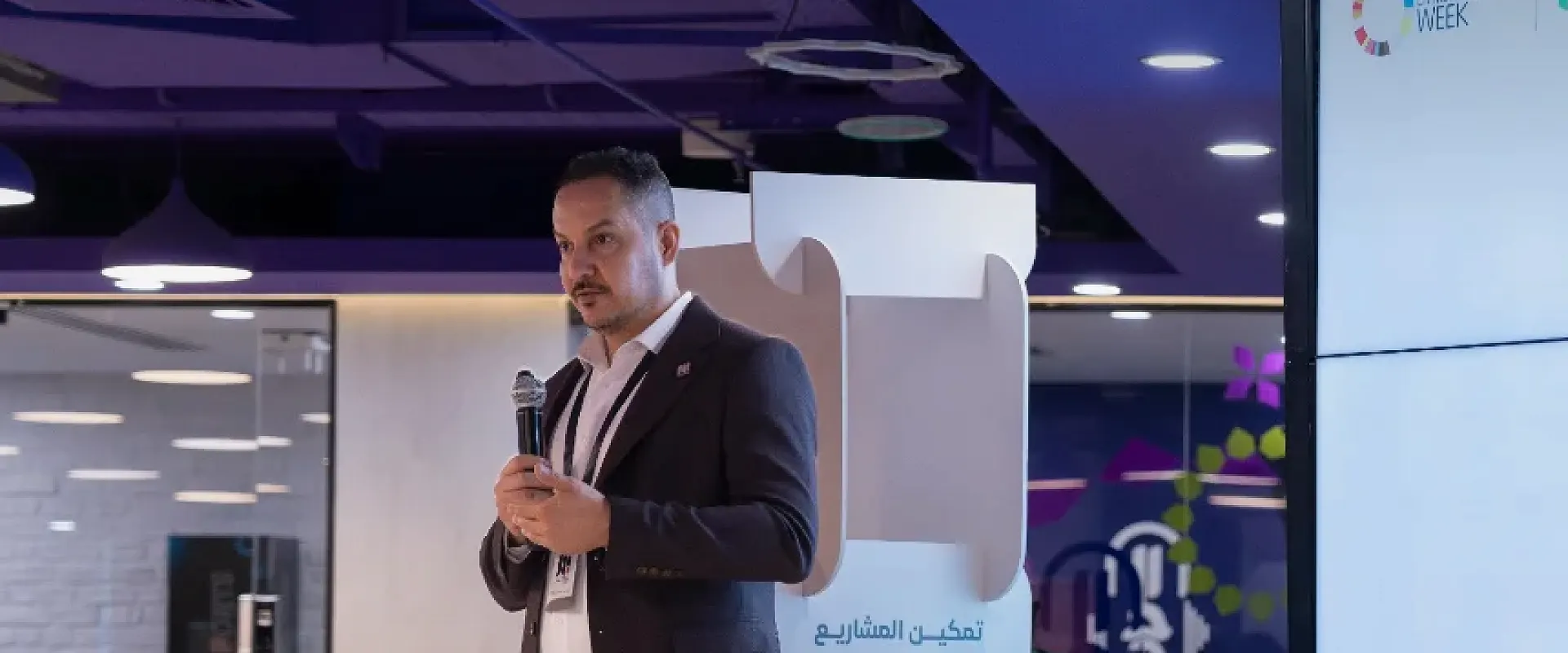 A speaker opens the first day of the AI Hackathon with a workshop on AI in the market, Global Entrepreneurship Week 2025.